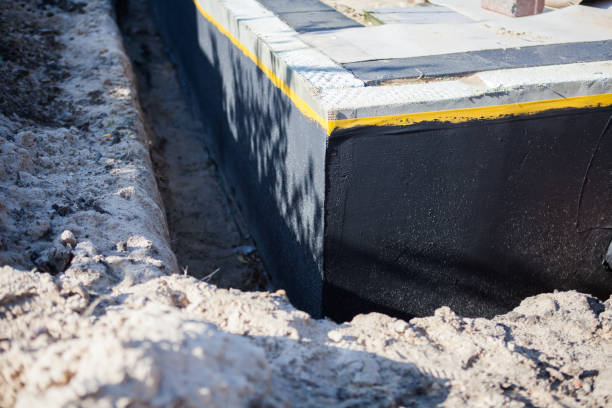 Professional Waterproofing technician working in Montezuma, NY